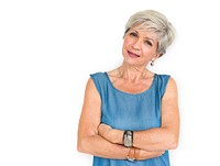 White haired lady with her arms around her body