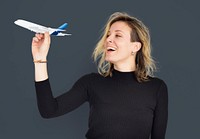 Blonde woman holding a toy plane