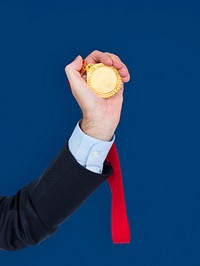 Business Attire Hand Holding Medal