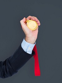 Business Attire Hand Holding Medal
