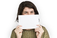 Woman holding a blank piece of paper to her nose and mouth