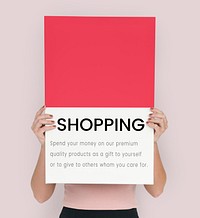 Woman holding a placard with a text shopping