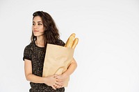 Girl carrying a bag of bread groceries