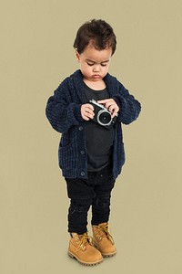 Curious Little Boy Holding Camera Concept