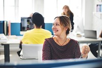 Closeup of cheerful caucasian woman working at office