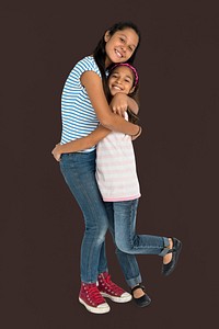 Two Asian Girl Sisters Hugging Togetherness Concept