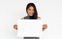 Studio portrait of an asian woman holding a blank placard