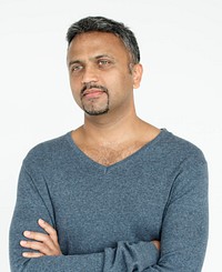 Indian guy arms crossed studio portrait