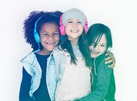 Group of Little Girls Studio Smiling Wearing Headphones and Winter Clothes