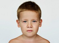Portrait of a young kid with a serious expression