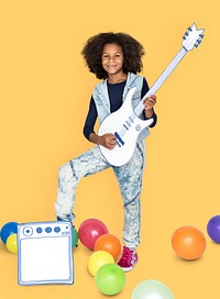 Portrait of a Little African Descent Girl with a Guitar Isolated