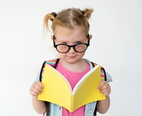 Portrait of a young girl reading a book