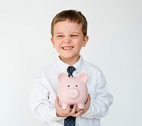 Portrait of a cute little boy with a piggybank