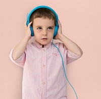 Caucasian Little Boy Trying Headphones