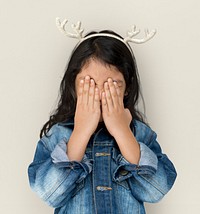 Little Girl Cover Eyes Wearing Reindeer Hairband
