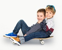 Little Kids Smiling Playing Sitting Skateboard