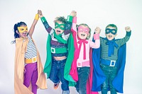 Superhero kids friends hands raised happiness together