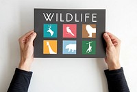 Hands holding a wildlife sign