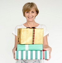 Woman holding a stack of gift boxes