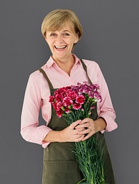 Senior Adult Woman Smiling Happiness Flower Studio Portrait