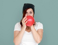 Woman Blowing Balloon Playful Studio Portrait