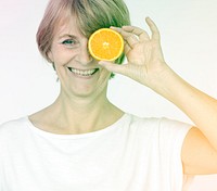 Senior woman posing with orange and happiness smiling