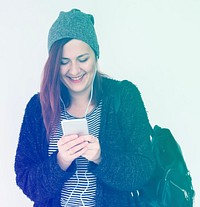 Woman listening music with smart phone and smiling