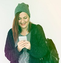 Woman listening music with smart phone and smiling