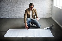 Guy with a big sheet of paper on the floor