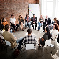 People in a discussion seated in a circle