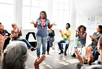 Woman talking surrounded by people in a circle