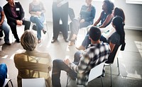 Group of people seated in a circle