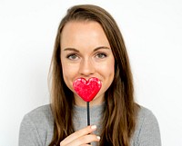 A happy woman with heart-shaped candy