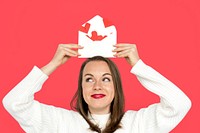 Woman holding envelope red paper hearts