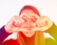 Happiness woman in love forming heart love hand sign