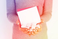Hands holding marshmallow heartshape gift