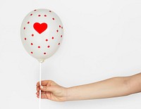 Hands Holding Balloon Heart Decoration
