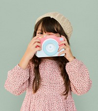 Little Girl Holding Papercraft Arts Camera Photogrphing Studio Portrait