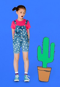 Little Girl Looking Papercraft Cactus