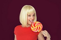 Caucasian Blonde Woman Tasting Lollipop