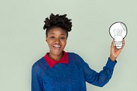 African Descent Woman Holding Light Bulb