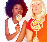 Diverse women friends happiness smiling and eating lollipop