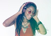 African woman listening music and smiling cheerful