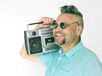 Senior man holding stereo media on white background