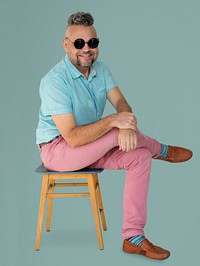 A Man with Sunglasses Sitting on a Chair