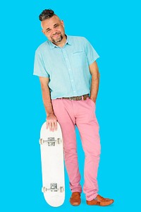 A Man Standing Holding Skateboard