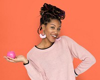 African Woman Holding Pink Apple with a Smile