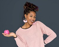 African Woman Holding Pink Apple with a Smile
