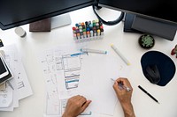 Man Working Planning Documents Diagram White Table