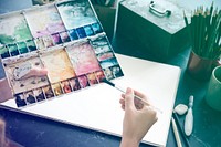 Artist painting colors illustration stationery on table